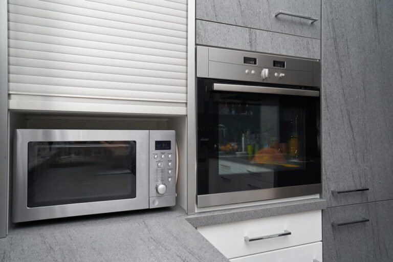 Metallic,Microwave,And,Oven,In,Gray,Kitchen,Interior